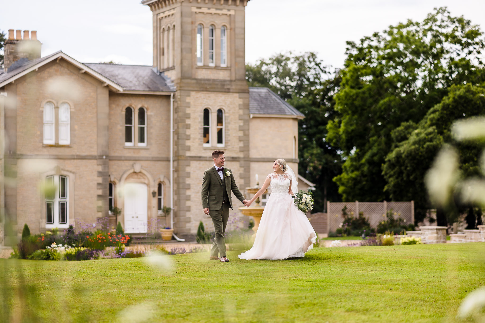 St Tewdrics building with couple of man and woman holding hands