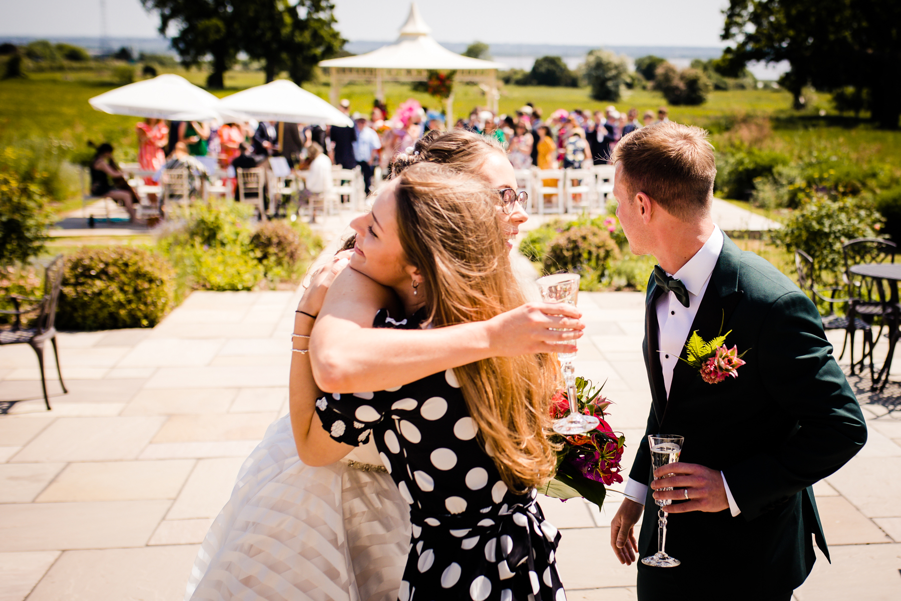 Wedding co-ordinator hugging our bride and groom - Laura Grace photography