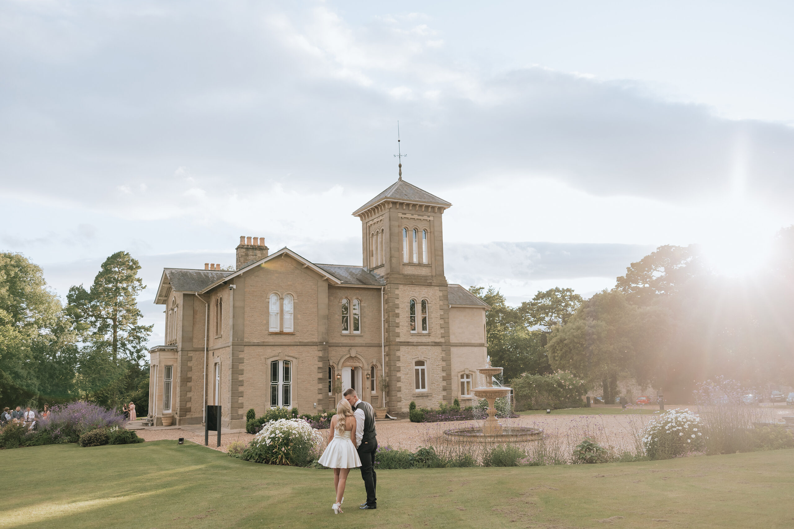 Wedding co-ordinator hugging our bride and groom - Laura Grace photography